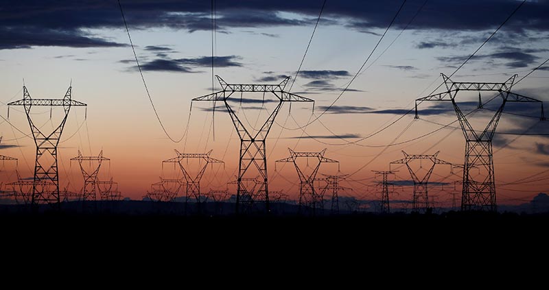 Pylons of high-tension electricity power lines are seen after sunset outside Goussainville, near Paris, France, on August 8, 2017.  Photo: Reuters