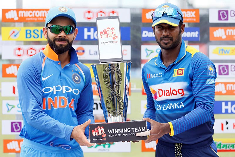 India's captain Virat Kohli and Sri Lanka's captain Upul Tharanga hold the trophy as they pose for photographs before the first One-Day International match between Sri Lanka and India, in Dambulla, Sri Lanka, on August 20, 2017. Photo: Reuters