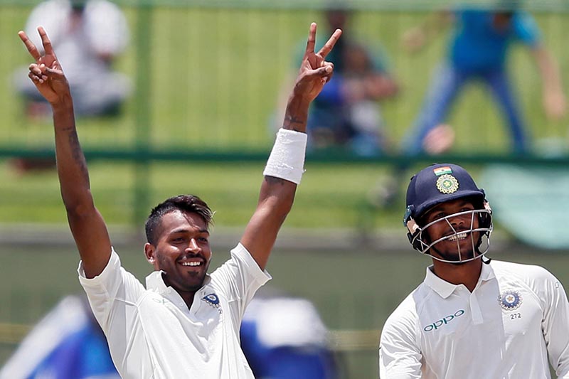 India's Hardik Pandya celebrates his century next to his teammate Umesh Yadav in third test match between Sri Lanka and India, in Pallekele, Sri Lanka, on August 13, 2017. Photo: Reuters