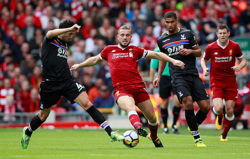 Liverpool's Jordan Henderson in action with Crystal Palace's Luka Milivojevic and Ruben Loftus-Cheek in action. Photo: Reuters