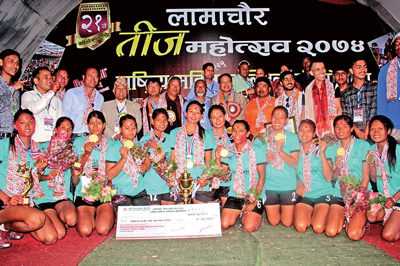 Nepal APF Club players and officials celebrate with the trophy after winning the Red Bull National Womenu2019s Volleyball Tournament in Pokhara, on Thursday. Photo: THT