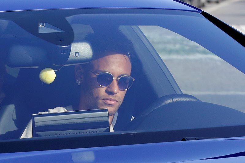 Brazilian soccer player Neymar drives to arrive to Joan Gamper training camp near Barcelona, Spain,  on August 2, 2017. Photo: Reuters