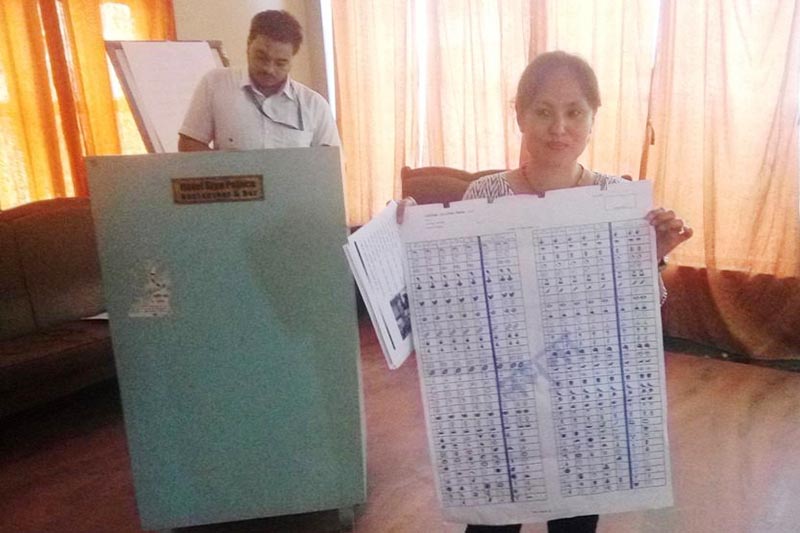 A District Election Office staffer showing a ballot paper at an interaction on local election and its system in Gaur, Rautahat, on Tuesday, August 29, 2017. Photo: THT