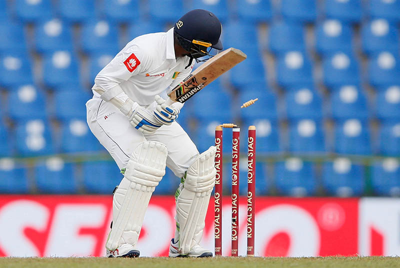 Sri Lanka's Upul Tharanga is bowled out by India's Umesh Yadav (not pictured). Photo: Reuters