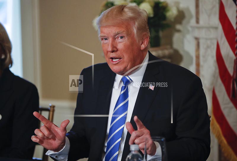 US President Donald Trump gestures as he answers a question regarding the ongoing situation in North Korea, on Friday, August 11, 2017, at Trump National Golf Club in Bedminster, New Jersey. Photo: AP