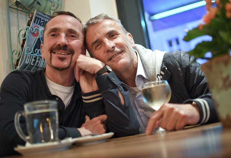 Karl Kreile (left), and Bodo Mende are sitting in the cafe Romeo &amp; Romeo in Berlin, Germany, on September  27, 2017. Photo: Britta Pedersen/dpa via AP