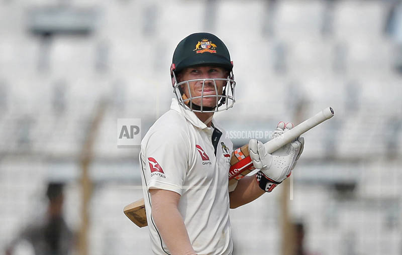 Australia's David Warner looks back as he walks back to the pavilion after his dismissal by Bangladesh's Mustafizur Rahman during the third day of their second test cricket match in Chittagong, Bangladesh, Wednesday, Sept. 6, 2017. Photo: AP