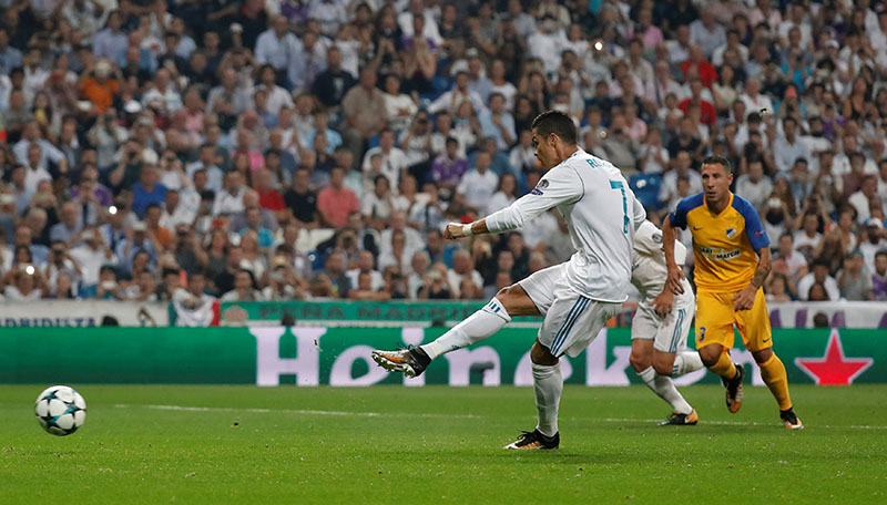 Real Madridu2019s Cristiano Ronaldo scores their second goal from a penalty. Photo: Reuters