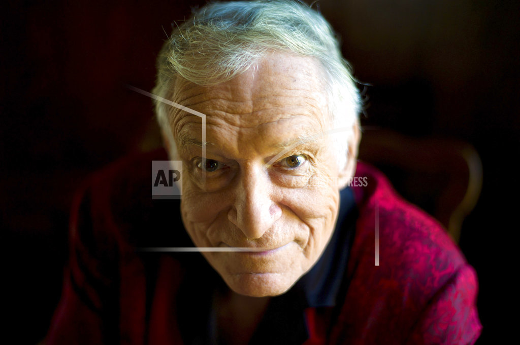 FILE - This Oct. 13, 2011 file photo shows American magazine publisher, founder and Chief Creative Officer of Playboy Enterprises, Hugh Hefner at his home at the Playboy Mansion in Beverly Hills, Calif. Playboy nmagazine founder and sexual revolution symbol Hefner has died at age 91. The magazine released a statement saying Hefner died at his home of natural causes on Wednesday night, Sept. 27, 2017, surrounded by family.  (AP Photo/Kristian Dowling, File)