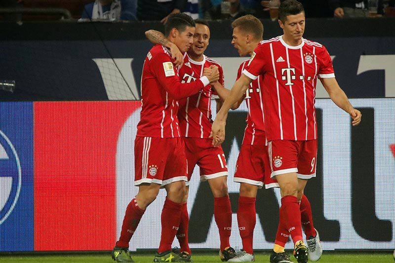 Bayern Munich's James Rodriguez celebrates scoring their second goal with team mates. Photo: Reuters