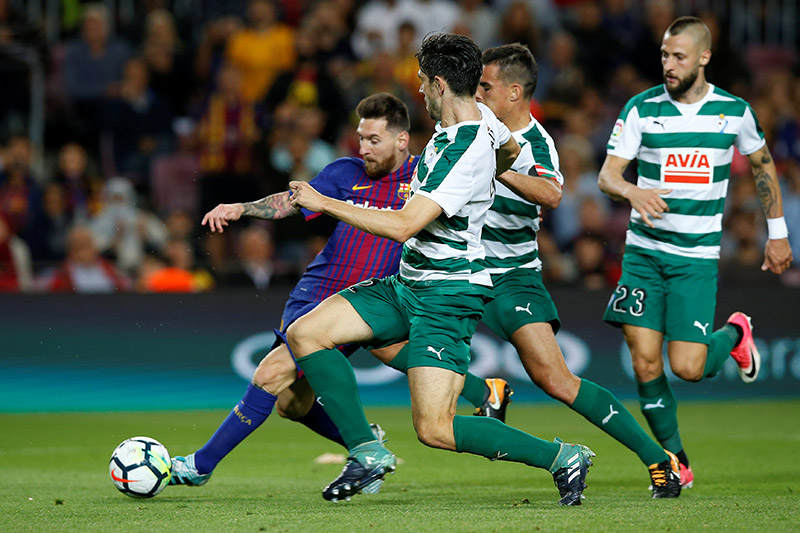 Barcelonau2019s Lionel Messi scores their fifth goal to complete his hat-trick during the Santander La Liga match between FC Barcelona ad Eibar, at Camp Nou, in Barcelona, Spain, on September 19, 2017. Photo: Reuters