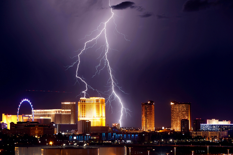 Lightning strikes behind Las Vegas Strip casinos as a thunderstorm passes through Las Vegas, Nevada, US, September 13, 2017. Photo: Reuters