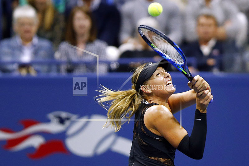 Maria Sharapova, of Russia, returns a shot to Sofia Kenin, of the United States, during the US Open tennis tournament, Friday, Sept. 1, 2017, in New York. Photo: AP