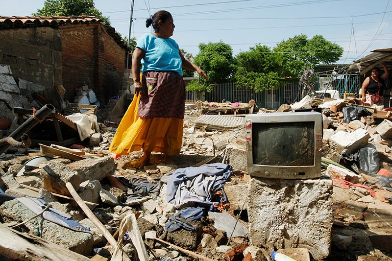 A woman stands amidst the remains of a house after an earthquake struck the southern coast of Mexico late on Thursday, in Union Hidalgo, Mexico, on September 9, 2017. Photo: Reuters