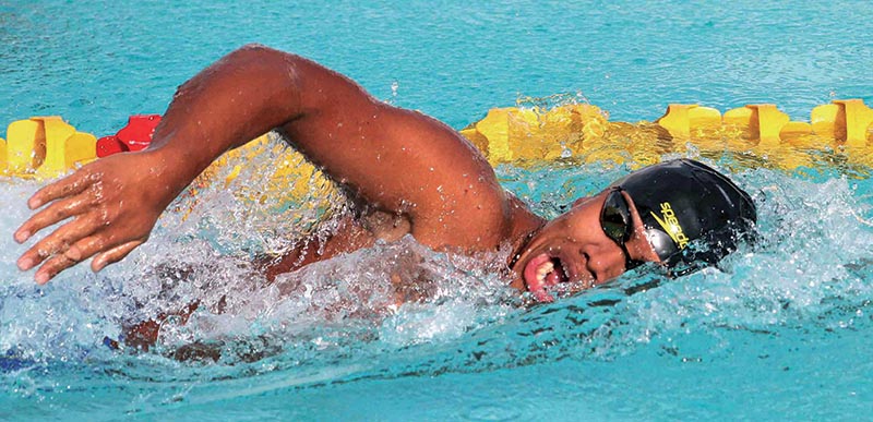 Olympian Sirish Gurung from Tribhuvan Army Club swims during the menu2019s 100m freestyle event of the NSA Cup Swimming Championship at the International Sports Complex pool in Lalitpur on Monday. Photo: Udipt Singh Chhetry