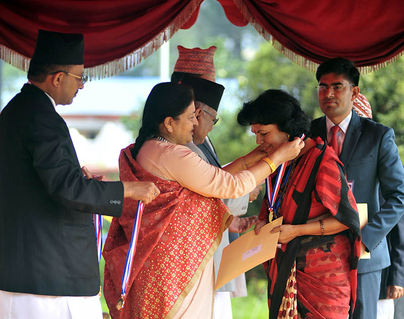 President Bidya Devi Bhandari awards medal to outstanding student on the ocasion of 38th National Education Day in Sheetal Niwas, Kathmandu, on Friday, September 8, 2017. Courtesy: President's Office