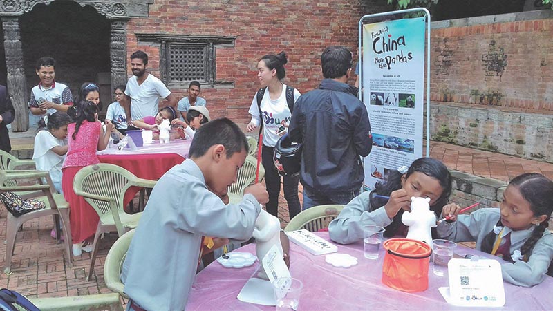 Children participating in a painting competition organised by National Tourism Administration of China, in Patan Durbar Square, Lalitpur, on Wednesday, September 20, 2017. Photo: RSS