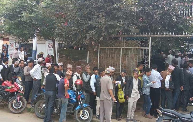 Service seekers queuing to withdraw money at the branch office of Nepal Bank Ltd, in Phidim, Panchthar, on Sunday, September 24, 2017. Photo: THT
