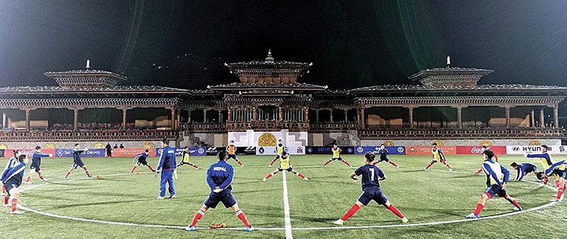 Nepal youth team players stretching during a training session at the Changlimithang National Stadium in Thimpu on Sunday. Photo: THT