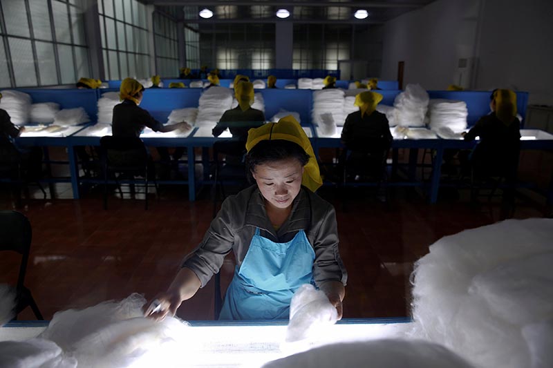 Women work at the Kim Jong Suk Pyongyang textile mill during a government organised visit for foreign reporters in Pyongyang, North Korea, on May 9, 2016. Photo: Reuters/ File