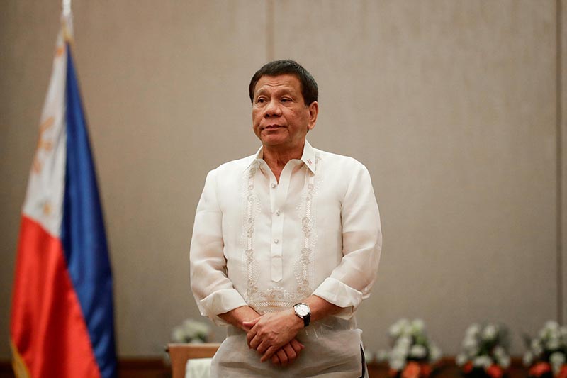 Philippines 'President Rodrigo Duterte stands at attention during a courtesy call with the Association of Southeast Asian Nations (ASEAN) Economic Ministers in Manila, Philippines, on September 6, 2017. Photo: Reuters