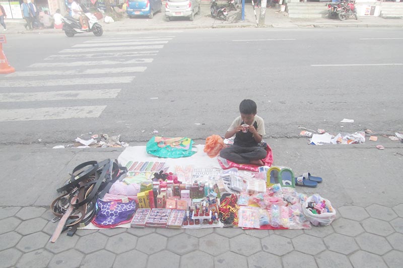 A boy drinks tea as he vends at Prithvi Chowk, in Pokhara, on Tuesday, September 19, 2017. The major festival Dashain is ahead that begins from Thursday. Photo: Rishi Ram Baral