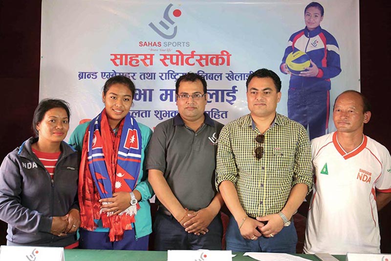 National Volleyball team member Pratibha Mali with officals during a farewell programme organised by Sahas Sports in kathmandu on Thursday. Photo: THT
