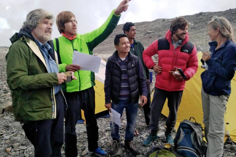 Reinhold Messner discussing route with son Simon Geaser Messner to Tare Khang Summit at the base camp. Courtesy: Thamserku Trekking