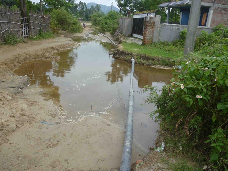 A view of exposed pipelines of Birendra Bazar-based Drinking Water Project, over a water-logged street, in Rupani Rural Municipality of Saptari district, on Tuesday, September 24, 2017. Photo: Byas Shankar Upadhyay