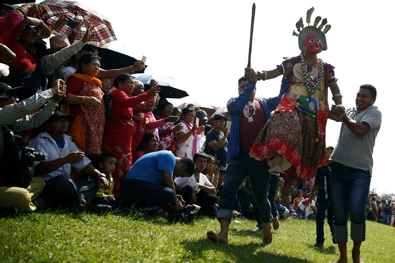 A man dressed as a deity jumps during Shikali festival, an alternative to Dashain festival, which is one of the biggest festivals of Hindus that dates back to 300 years observed by the people from ethnic Newar community in Lalitpur,l on Tuesday, September 26, 2017. Photo: Skanda Gautam