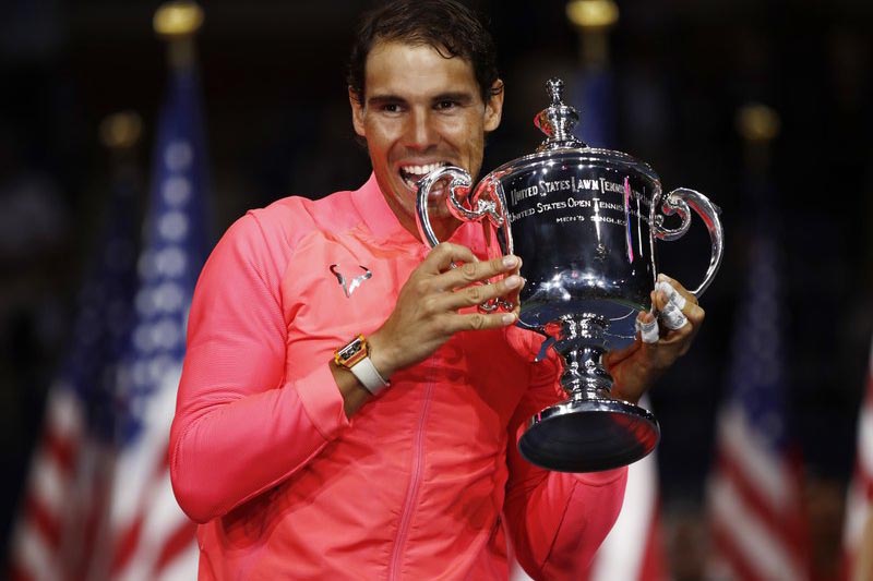 Rafael Nadal, of Spain, holds up the championship trophy after beating Kevin Anderson, of South Africa, in the menu2019s singles final of the US Open tennis tournament, in New York, on Sunday, September 10, 2017. Photo: AP