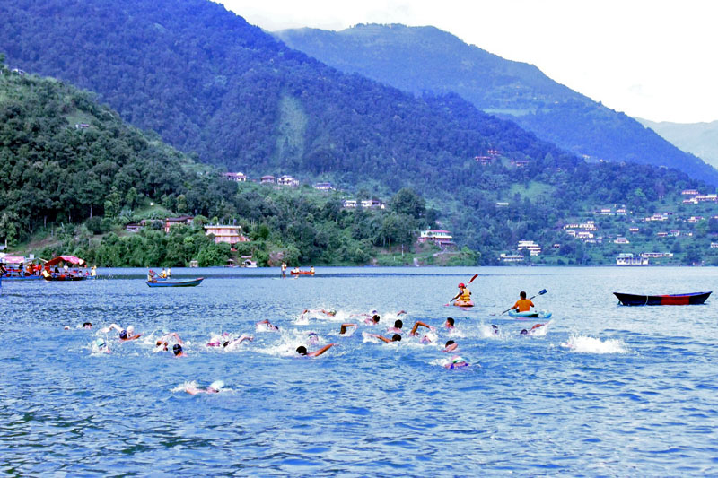 Participants take part in the 7th open swimming competition in Pokhara, on Saturaday, September 23, 2017. Photo: THT Online