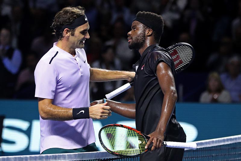 Roger Federer of Switzerland shakes hands with Frances Tiafoe of the US after defeating him in the 1st round of ATP 500, at Swiss Indoors, Basel, in St. Jakobshalle, Basel, Switzerland, on October 24, 2017. Photo: Reuters