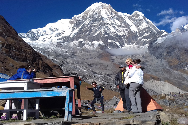 A tourist is seen taking a portarit of her friends at Annapurna Base Camp, on Wednesday, October 25, 2017. Photo: RSS
