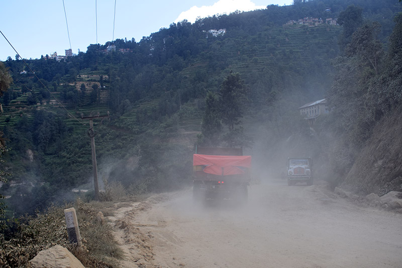 Vehicles pass through cloud of dust along Araniko Highway in Dhulikhel of Kavre district, on Monday, October 9, 2017. Photo: RSS