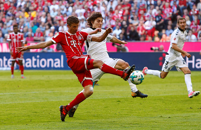 Bayern Munich's Thomas Muller in action with SC Freiburgu2019s Caglar Soyuncu. Photo: Reuters
