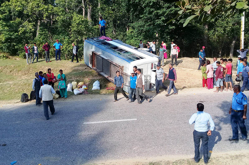 FILE: Locals gather around a bus that turned turtle along Mahendra Highway in Kanchanpur district, on Wednesday, October 25, 2017. Photo: RSS