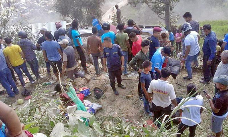 Locals gather around the accident site to rescue the survivors, near Dhadingbesi of Dhading district, on Tuesday, October 10, 2017. Photo: Keshav Adhikari