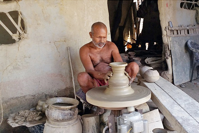 A man is seen making earthern pot in Sunsari district, on Monday, October 16, 2017. Photo: RSS