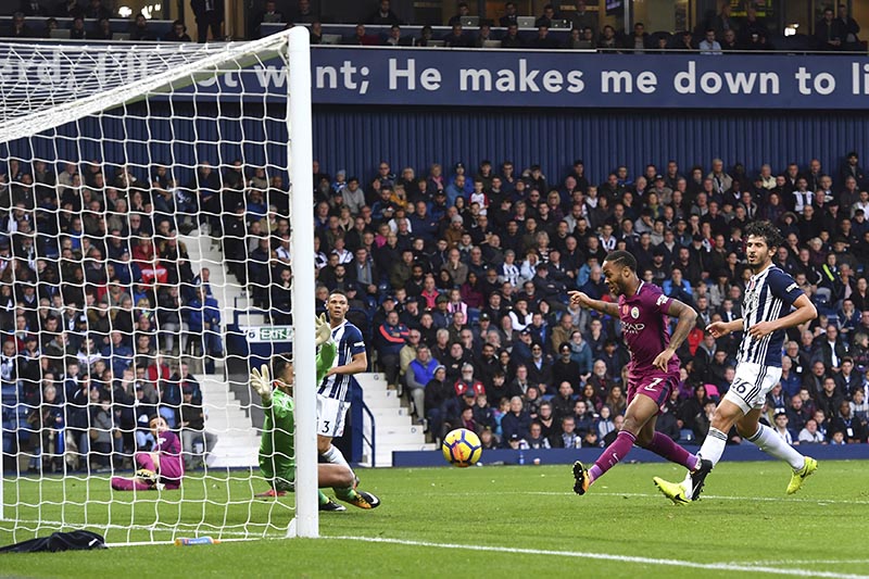 Manchester City's Raheem Sterling (2nd right), scores his side third goal during the English Premier League soccer match between West Bromwich Albion and Manchester City, at the Hawthorns in West Bromwich, England, on Saturday, October 28, 2017. Photo: Anthony Devlin/PA via AP
