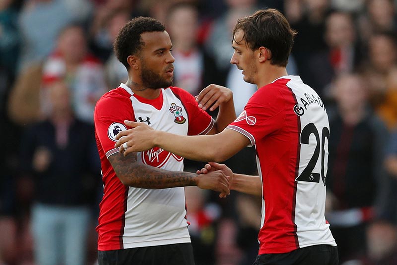 Southampton's Manolo Gabbiadini celebrates scoring their first goal with Ryan Bertrand (left) during the Premier League match between Southampton and Newcastle United, at St. Mary's Stadium, in Southampton, Britain, on October 15, 2017. Photo: Action Images via Reuters