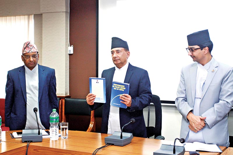 Finance Minister Gyanendra Bahadur Karki launching a book titled u2018Performance of Value Added Tax in Nepalu2019, in Kathmandu, on Monday. Courtesy: MoF