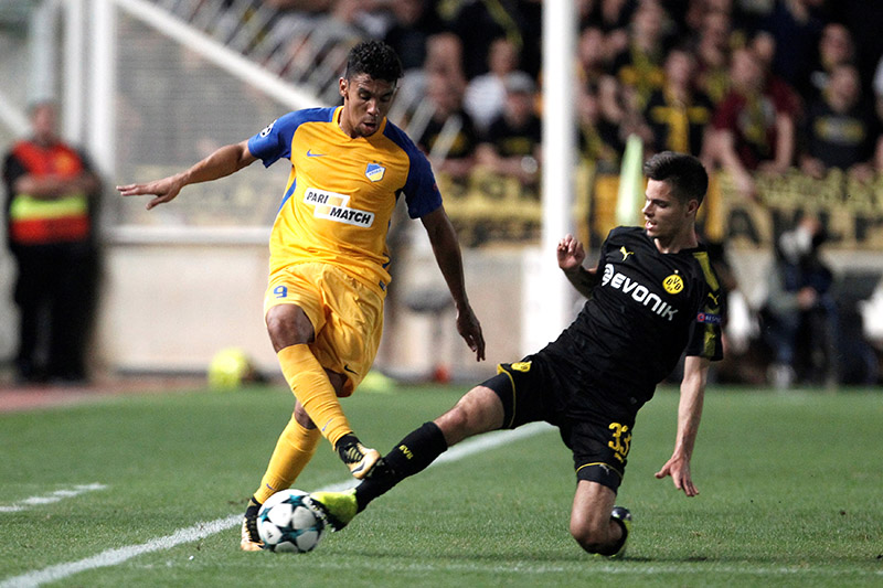 Apoel Nicosiau2019s Igor de Camargo in action with Borussia Dortmundu2019s Julian Weigl. Photo: Reuters