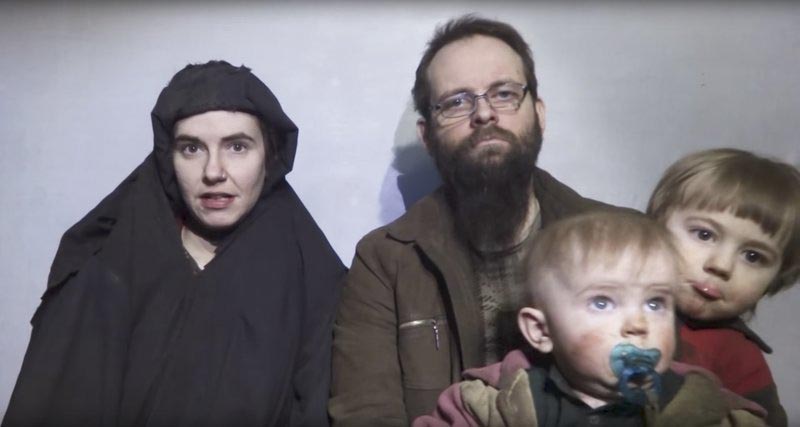 In this image from video released by Taliban Media in December 2016, Caitlan Coleman talks in the video while her Canadian husband Joshua Boyle holds their two children. Photo: AP