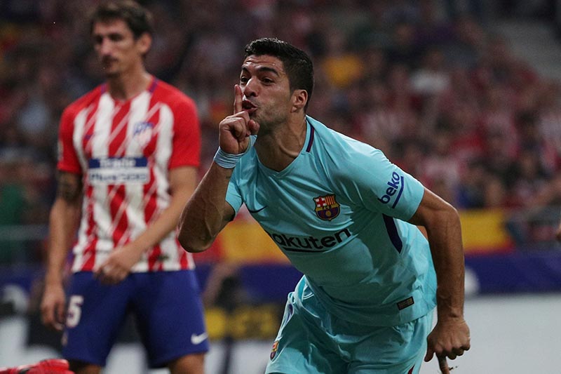 Barcelonau2019s Luis Suarez celebrates scoring their first goal during the La Liga Santander match between Atletico Madrid and Barcelona, at Wanda Metropolitano, in Madrid, Spain, on October 14, 2017. Photo: Reuters