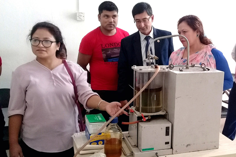 Nepal Academy of Science and Technology displaying a machine producing diseal from plastic in Chitwan, on Monday, October 23, 2017. Photo: RSS