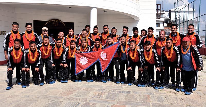 Nepal U-19 football team members pose for a group photo after a farewell programme in Lalitpur on Sunday. Photo: Naresh Shrestha/ THT