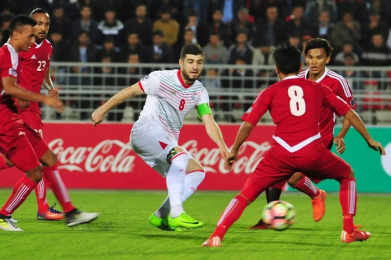 Tajikistani player tries to dribble past Nepali defense during AFC Asian Cup Qualifier at the National Stadium in Dushane, Tajikistan, on Tuesday, October 10, 2017. Courtesy: AFC