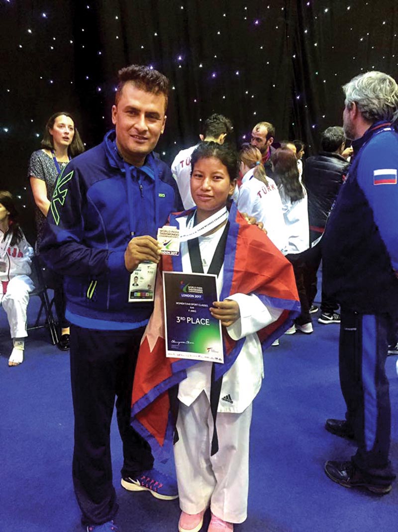 Nepalu2019s Ranjana Dhami with coach Kalyan Kunwar after winning medal in World Para-taekwondo Championships in London.