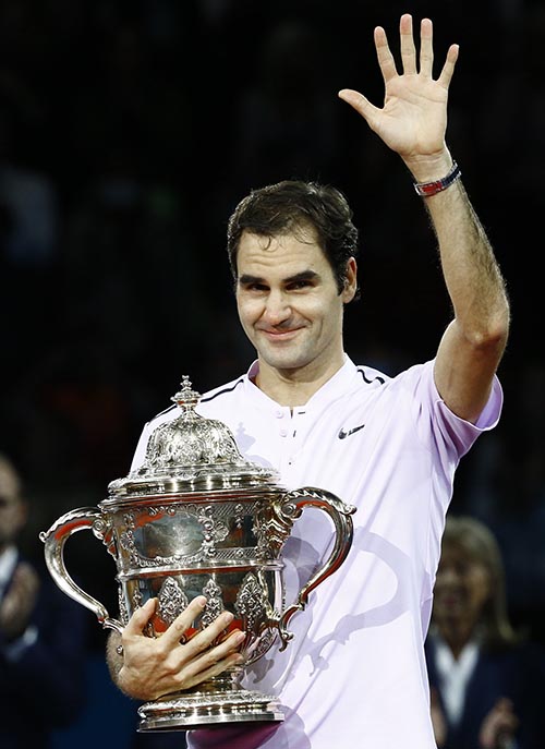Roger Federer of Switzerland celebrates with the cup after defeating Juan Martin del Potro of Argentina in ATP 500 Swiss Indoors Basel Final, at  St. Jakobshalle, in Basel, Switzerland, on October29, 2017. Photo: Reuters